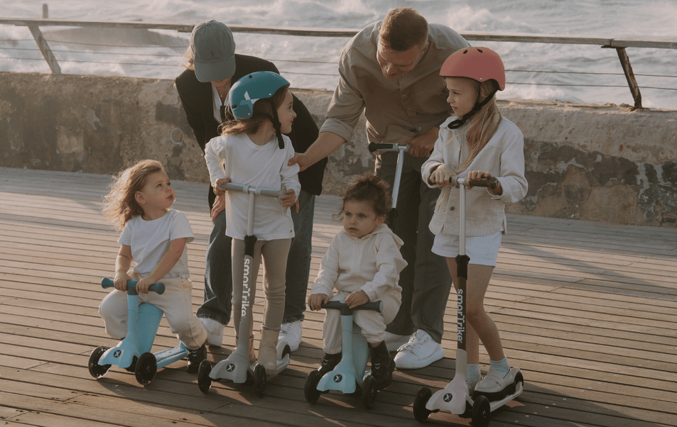 a group of children on scooters