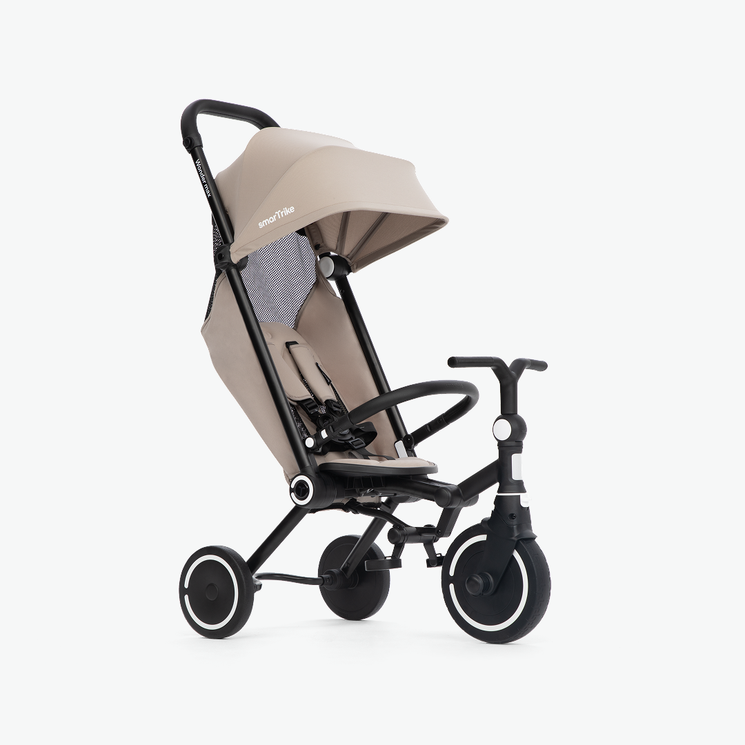 Beige baby stroller with black frame on a white background