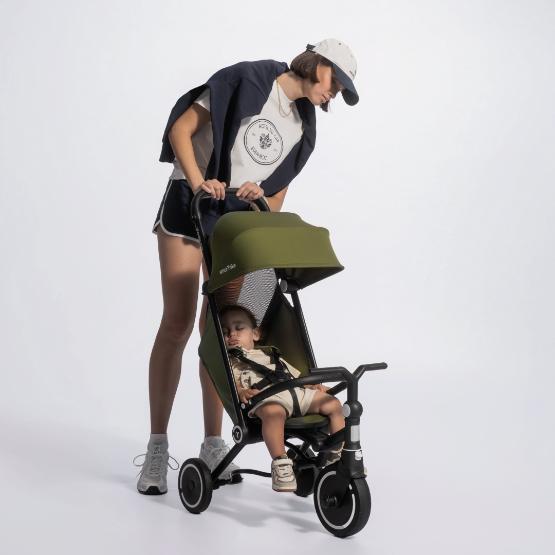 a woman pushing a baby in a stroller
